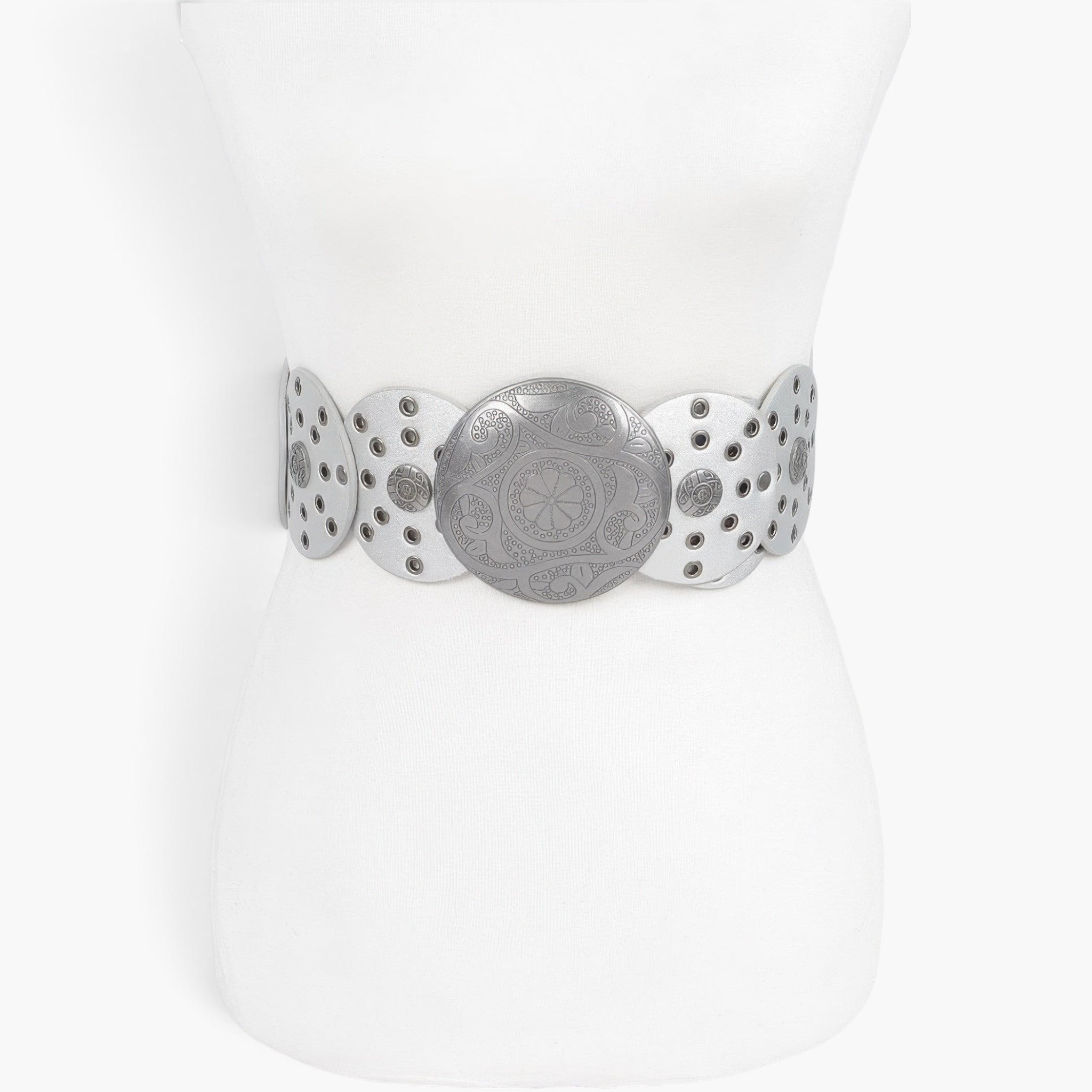 Beach Rose Co. silver faux leather western belt with multi eyelets and a large ornate round buckle on a mannequin