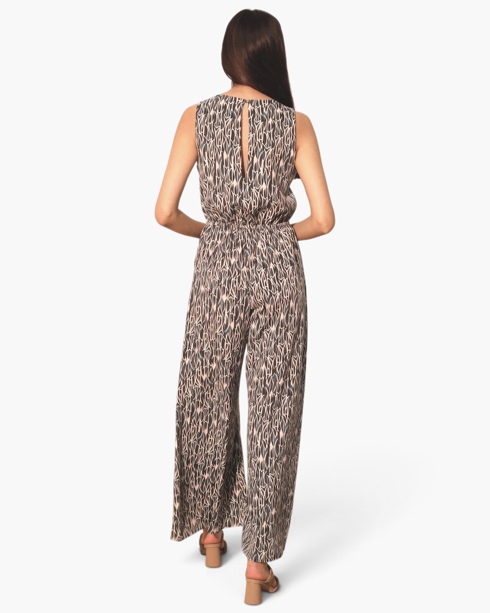 Beach Rose Co. sleeveless bubble jumpsuit in a black and beige abstract print with a back keyhole detail