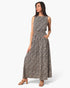 Beach Rose Co. sleeveless bubble jumpsuit in a black and white abstract print worn by a model with tan heels