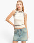 Beach Rose Co. sleeveless ribbed knit top in cream with black contrast trim, worn by a model with a denim skirt.