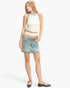 Beach Rose Co. sleeveless ribbed knit top in cream with black contrast trim, paired with a denim mini skirt.
