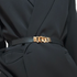 Beach Rose Co. slim black stretch waist belt featuring a gold-toned chunky chain-link buckle worn over a black blazer.