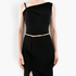 Beach Rose Co. slim gold-toned iron waist belt with a rectangular clasp worn over a sleek black dress