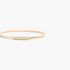 Beach Rose Co. slim iron waist belt with a finely ridged gold-tone band and a polished rectangular front clasp.