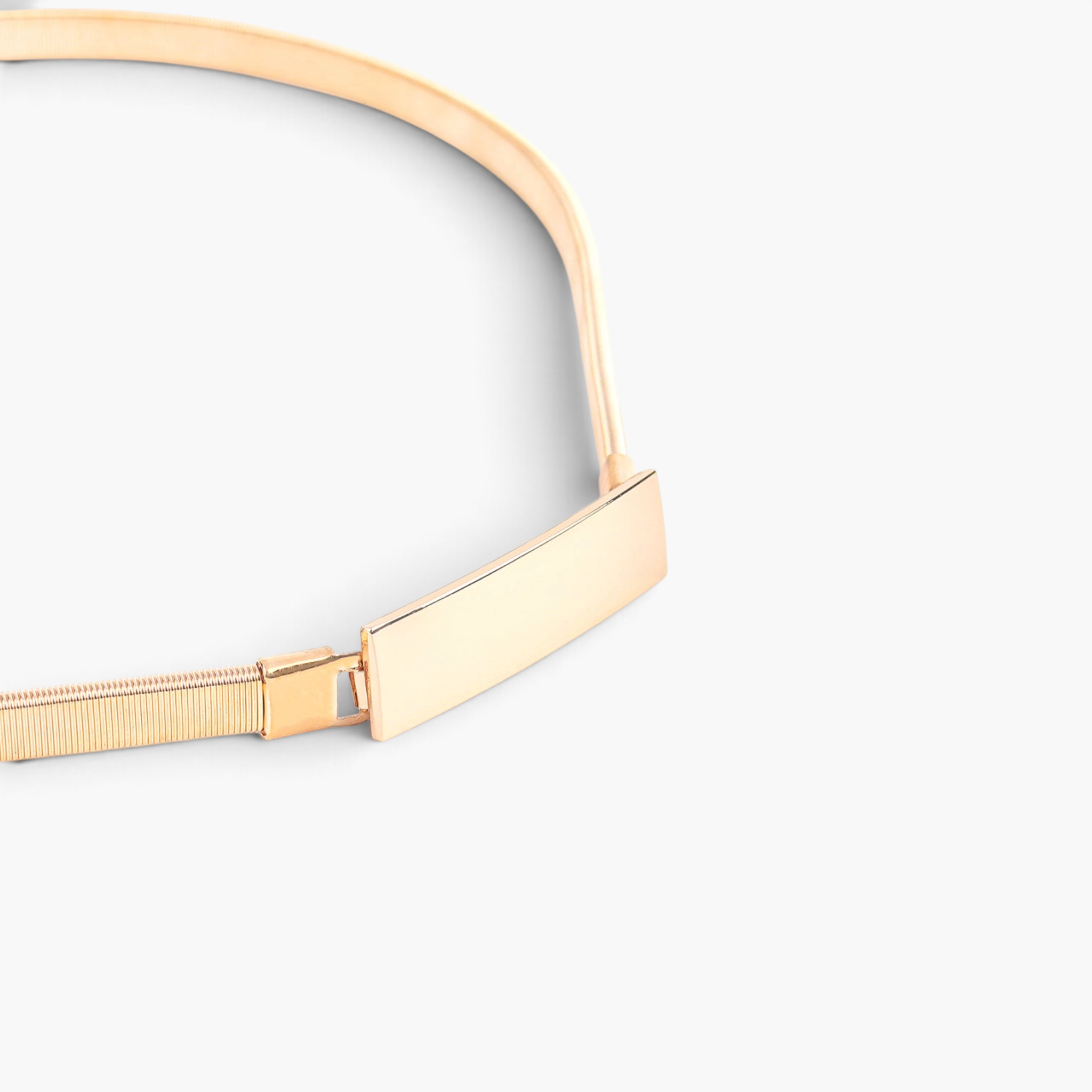 Beach Rose Co. slim gold-tone iron waist belt featuring a finely ridged band and a polished rectangular front clasp.
