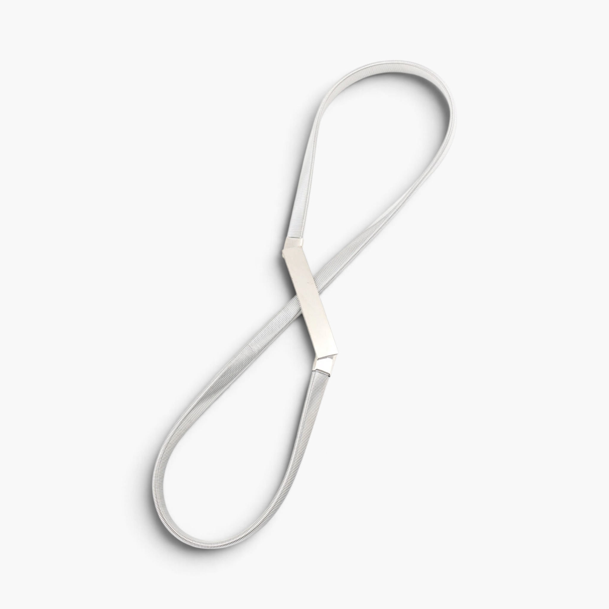 Beach Rose Co. slim silver iron waist belt with a textured ridged band and a polished rectangular metal clasp.