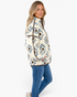 Beach Rose Co. cream and blue Southwestern print plush fleece half-zip pullover with brown trim worn by a woman.