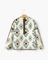 Beach Rose Co. cream and blue plush fleece pullover with a Southwestern geometric pattern and brown half-zip trim.