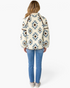 Beach Rose Co. cream and blue Southwestern print plush fleece pullover with brown trim, back view on a model.