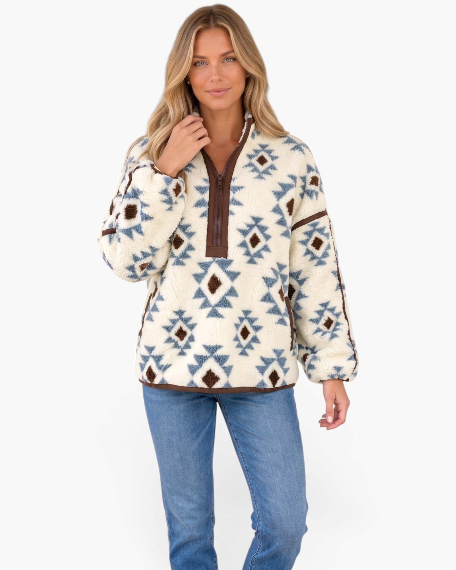 Beach Rose Co. cream and blue Southwestern print plush fleece half-zip pullover with brown trim on a blonde model.