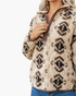 Beach Rose Co. cream and brown Southwestern print sherpa half-zip pullover with brown contrast trim and stand collar.