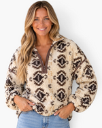 Beach Rose Co. cream and brown Southwestern print sherpa pullover with a half-zip neckline and contrast seam details.