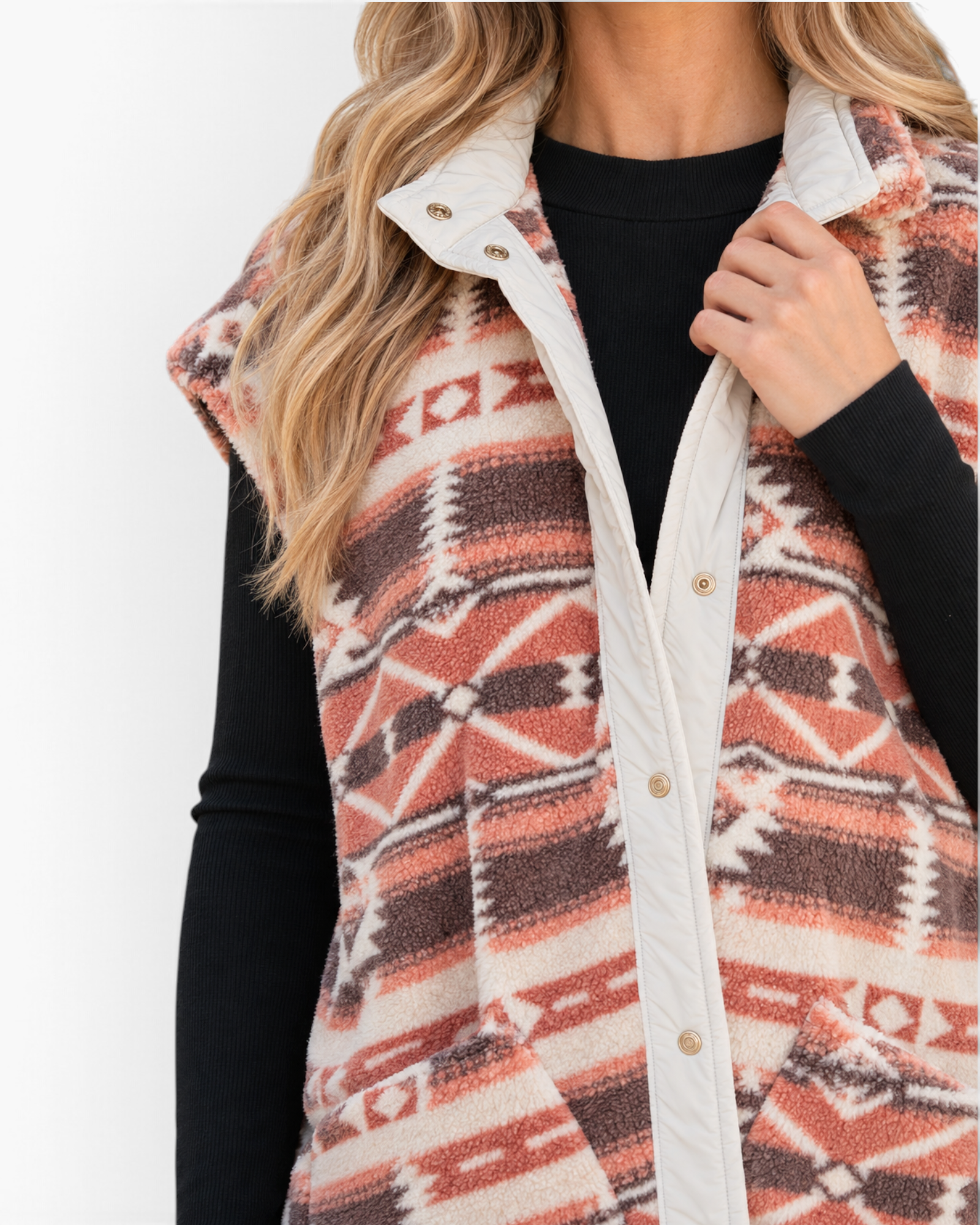 Beach Rose Co. sherpa vest featuring a rust and cream Southwestern geometric print with a snap-front stand collar.