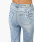 Beach Rose Co. light wash high-rise dad jeans featuring frayed star and heart patchwork on the back pockets.