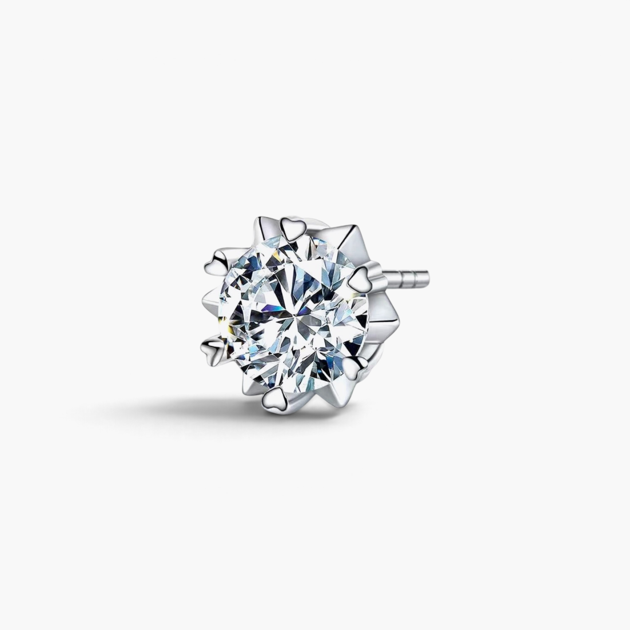 Beach Rose Co. silver starburst moissanite stud earring with heart-shaped prongs and a round 2-carat stone.
