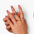 Beach Rose Co. gold and silver signet rings with engraved starburst details and clear zircon stones on fingers
