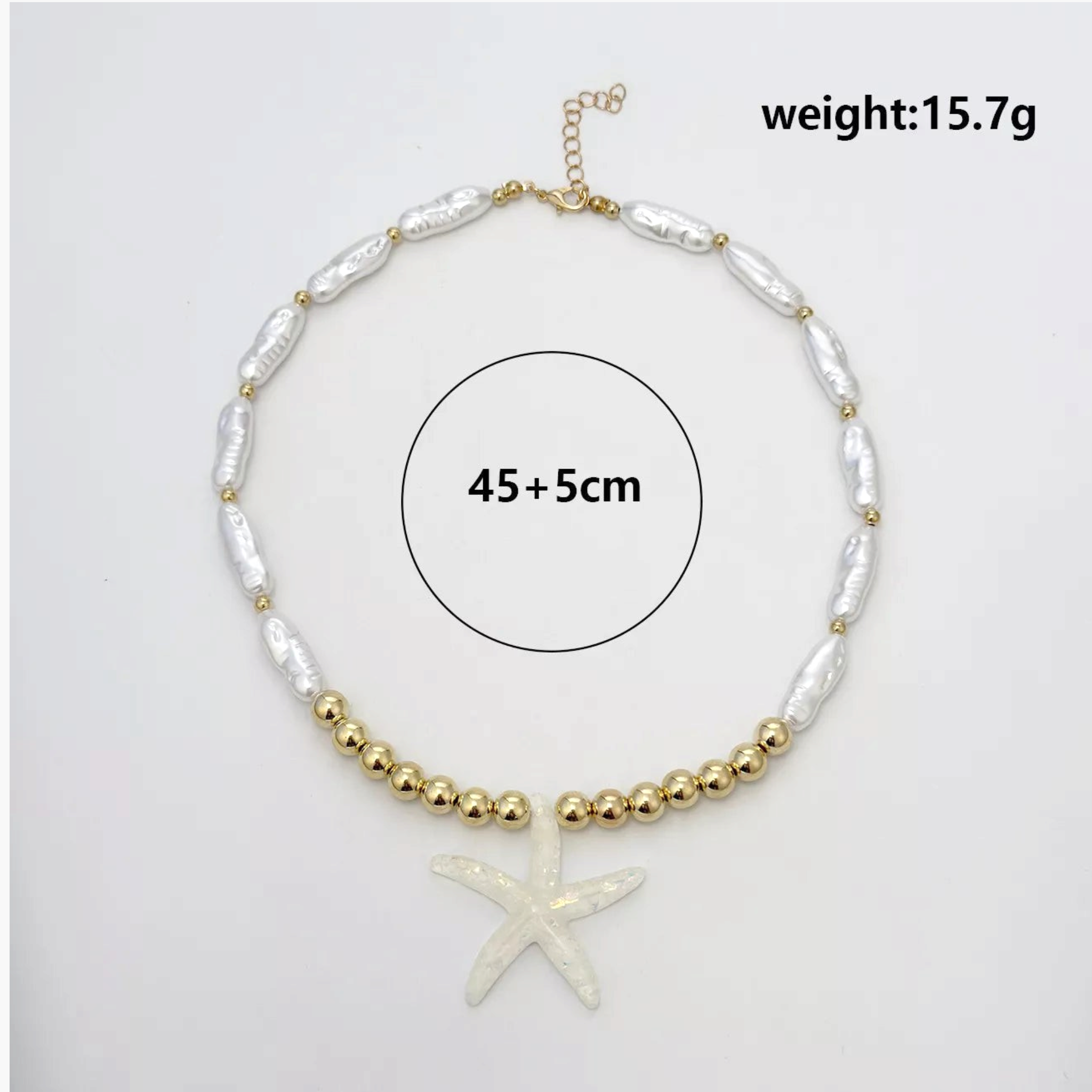 Beach Rose Co. 18K gold-plated necklace with elongated faux pearls, polished gold beads, and an iridescent starfish.