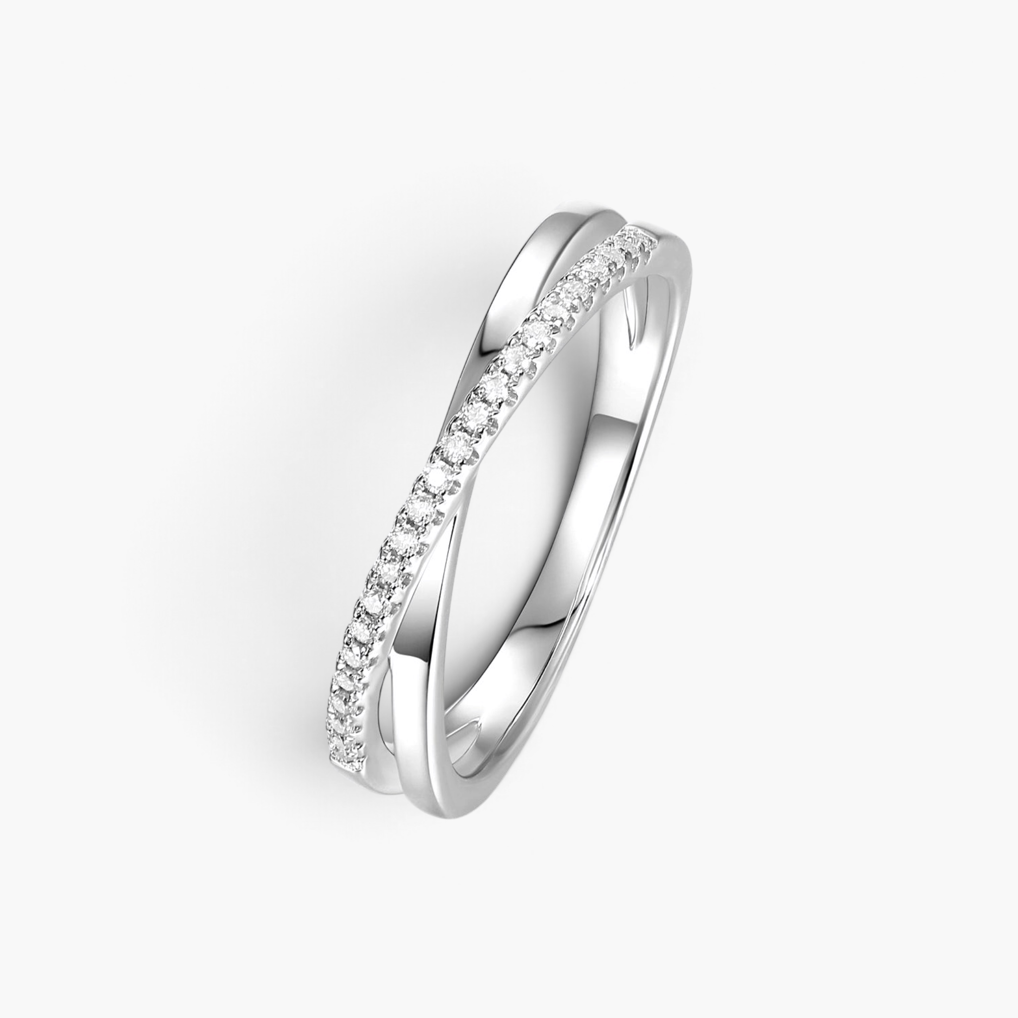 Beach Rose Co. sterling silver crisscross ring featuring a delicate band with sparkling moissanite stones.