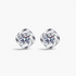Beach Rose Co. sterling silver flower stud earrings featuring round moissanite stones in a polished petal setting.