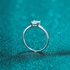 Beach Rose Co. sterling silver solitaire ring featuring a square moissanite stone in a four-prong setting.