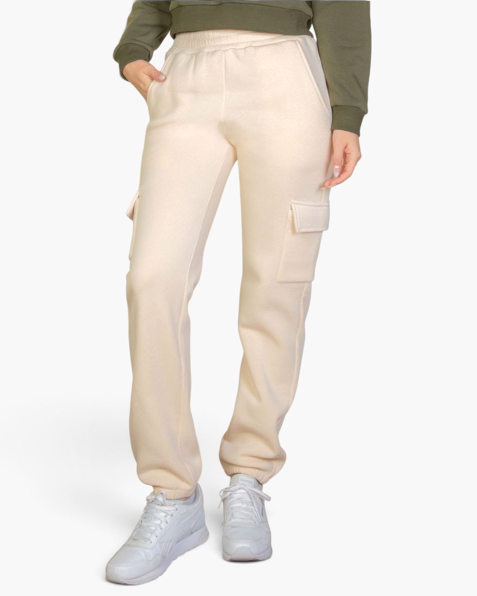 Beach Rose Co. stone-colored drawstring sweatpants with side cargo pockets worn by a model with white sneakers