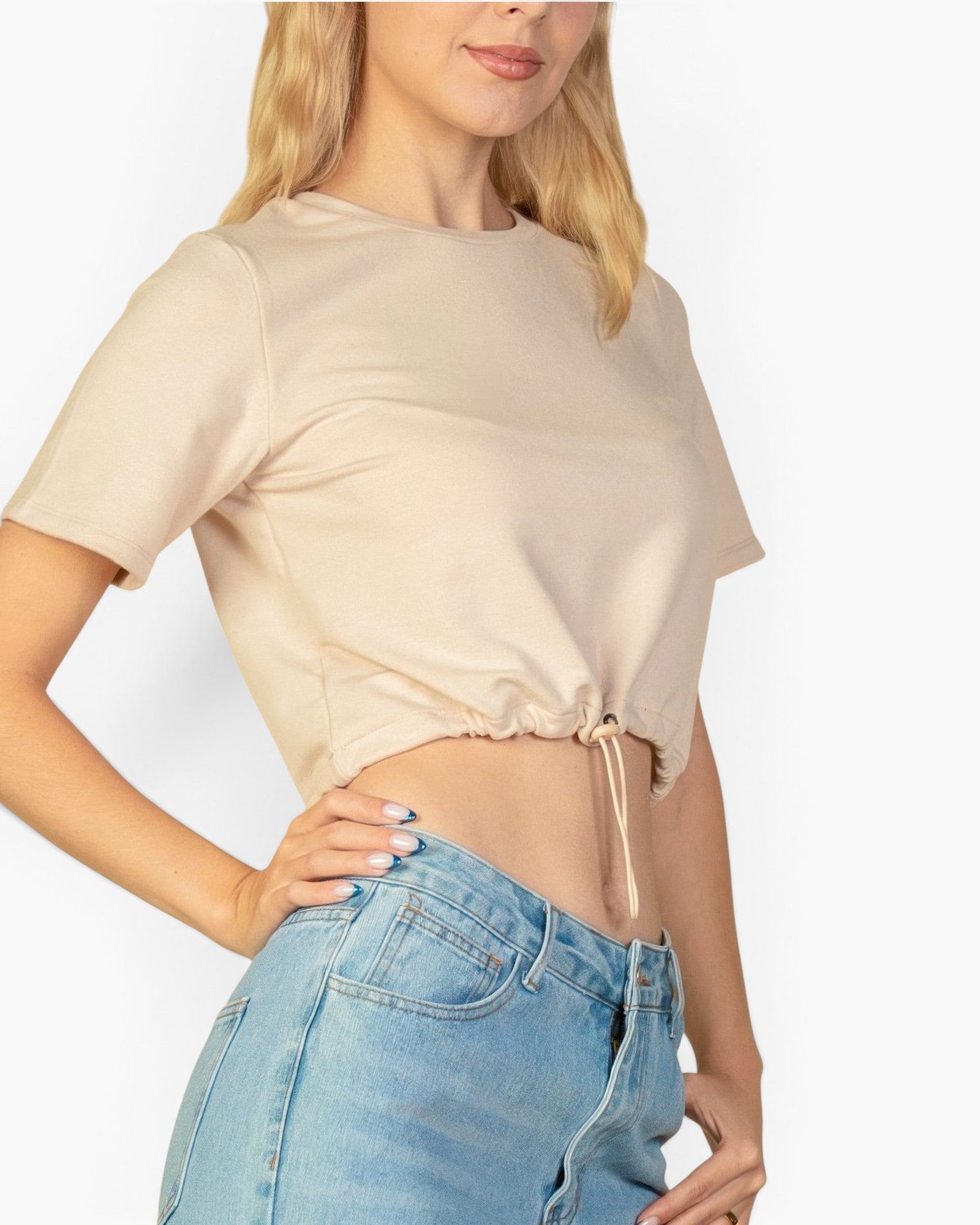 Beach Rose Co. stone-colored French Terry crop top with an adjustable toggle drawstring hem worn by a blonde model.