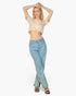 Beach Rose Co. stone-colored French Terry crop top with a toggle drawstring hem worn by a blonde model with jeans