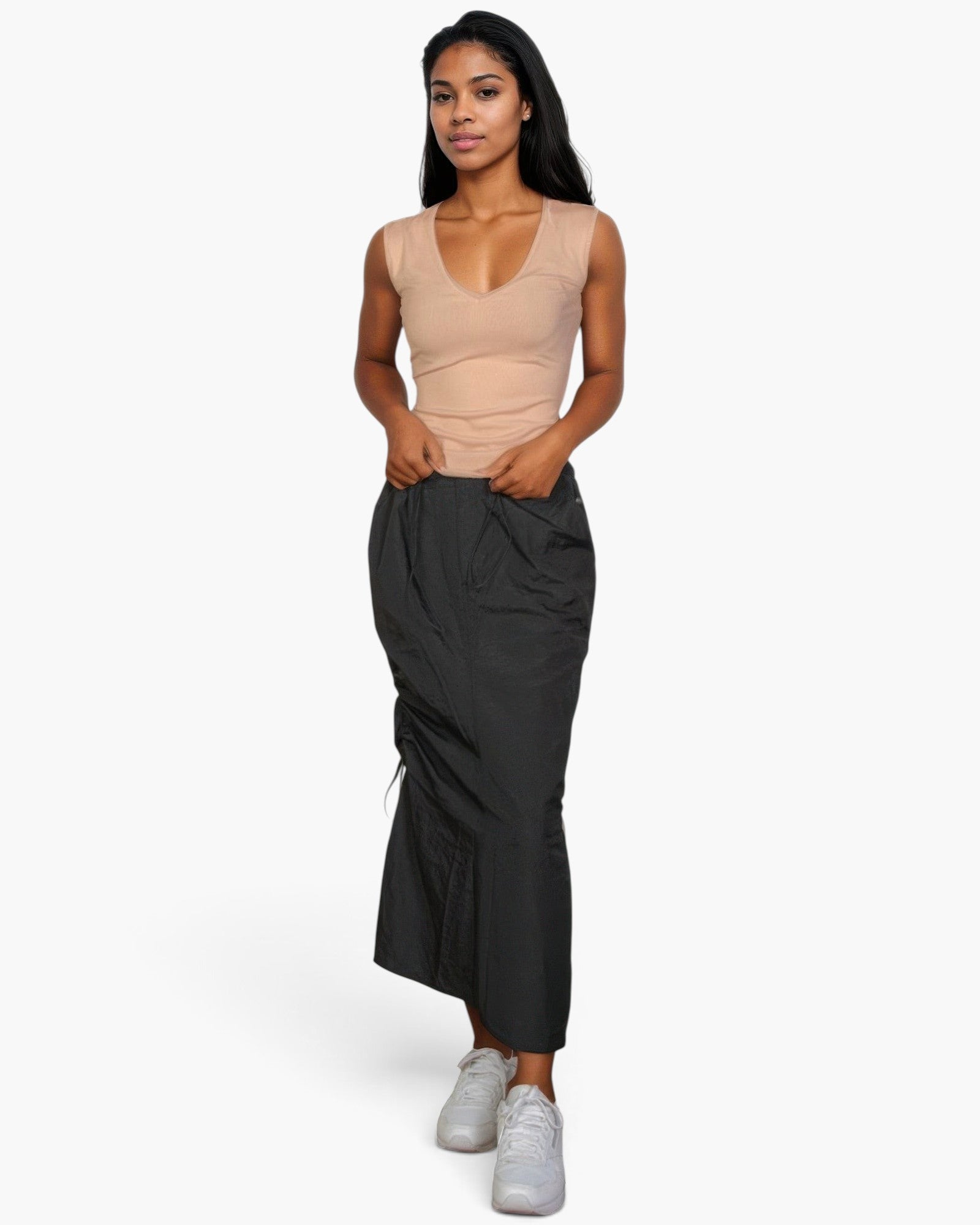 Beach Rose Co. stone ribbed V-neck sleeveless top worn by a woman with a black maxi skirt and white sneakers
