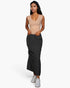 Beach Rose Co. stone ribbed V-neck sleeveless top worn by a woman with a black maxi skirt and white sneakers