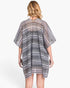 Back view of a woman wearing a Beach Rose Co. multi-color stripe crochet open-front cover-up with a relaxed fit.
