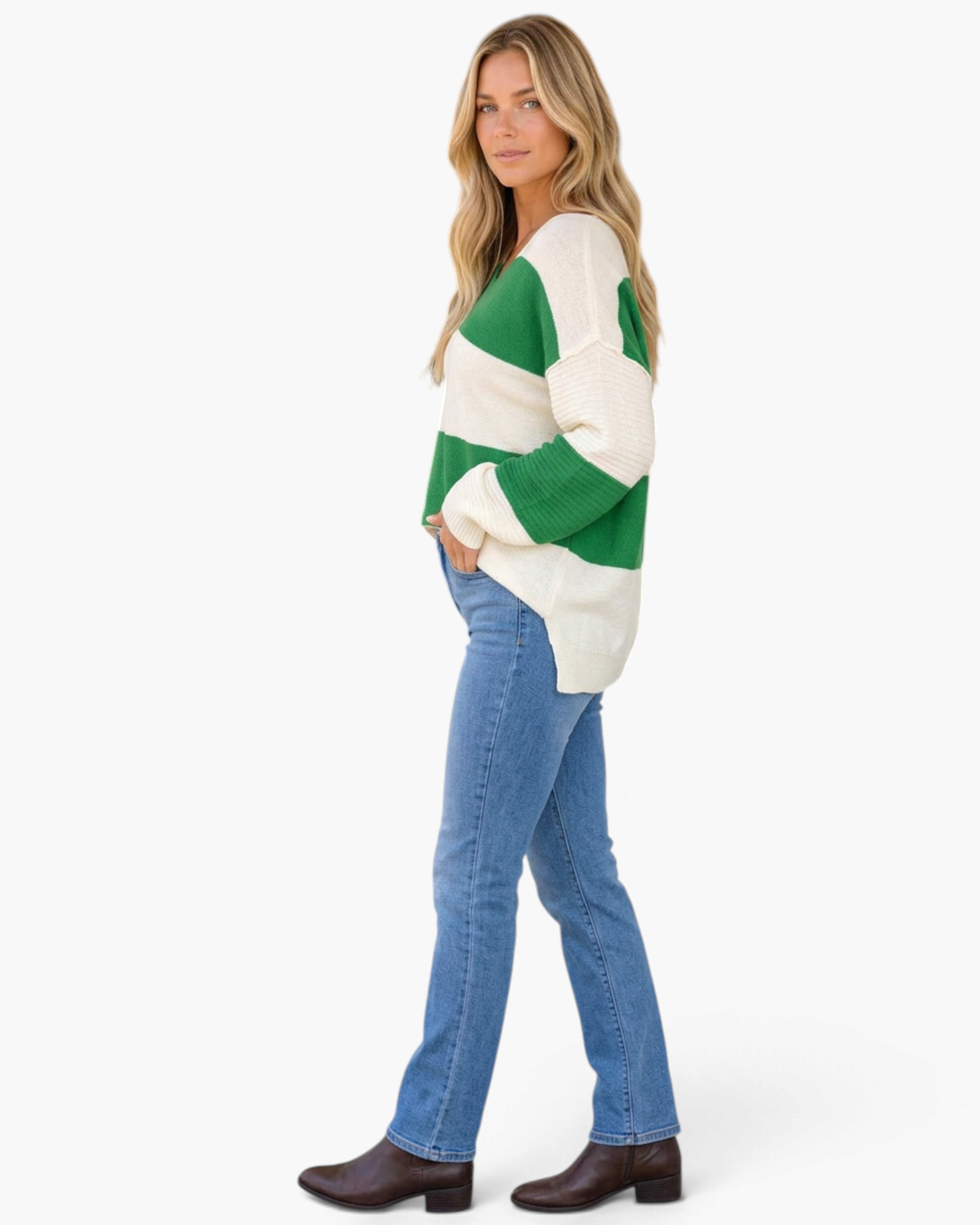 Beach Rose Co. model wearing a green and cream striped V-neck sweater with balloon sleeves and side slits