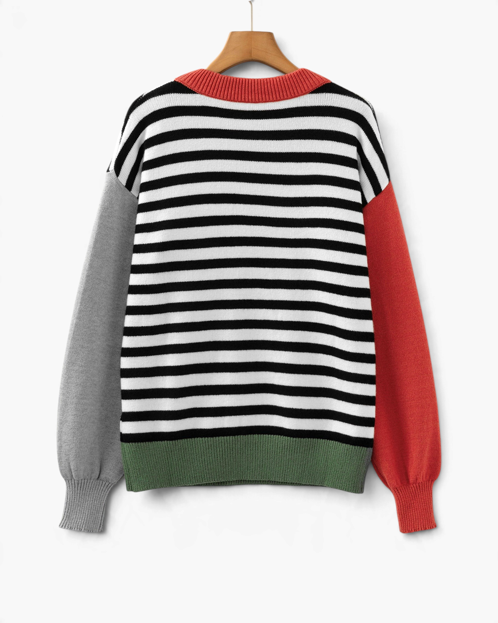 Beach Rose Co. black and cream striped sweater with color block sleeves, rust neckline, and olive hem on a hanger.