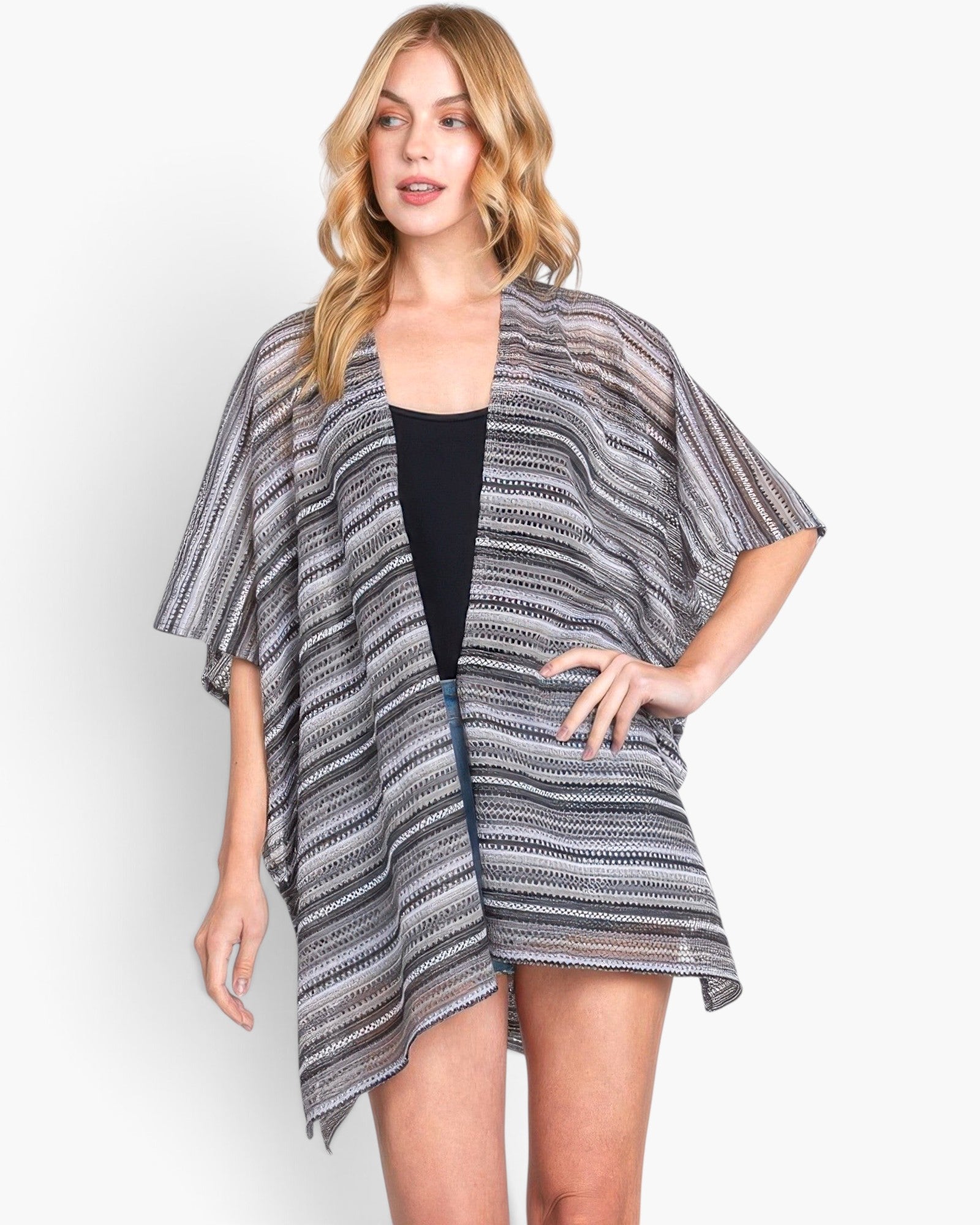 Beach Rose Co. model wearing a grey and white striped open-front crochet cover-up with a relaxed fit