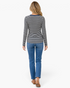 Beach Rose Co. gray and black striped long-sleeve Henley top with denim-look trim worn with blue jeans, back view.