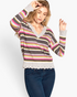 Beach Rose Co. model wearing a multi-colored variegated striped v-neck knit sweater with ruffled hem and long sleeves.