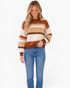 Beach Rose Co. Madilynne multi-color striped knit sweater with crew neck and long sleeves on a smiling model