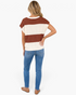 Beach Rose Co. rust and ivory striped open-knit top with cap sleeves and a relaxed fit, worn with blue jeans