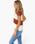 Beach Rose Co. rust and ivory striped open-knit split-neck top with cap sleeves worn by a blonde model in profile