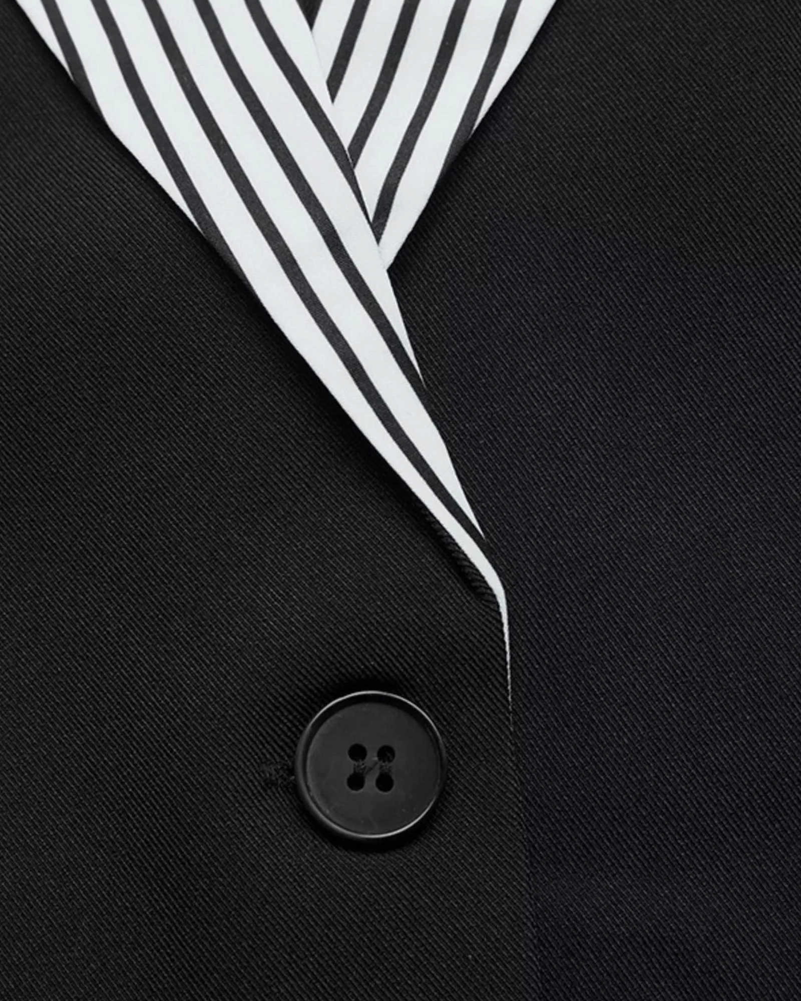 Beach Rose Co. black blazer featuring a contrasting black and white striped notched lapel and single-button closure.
