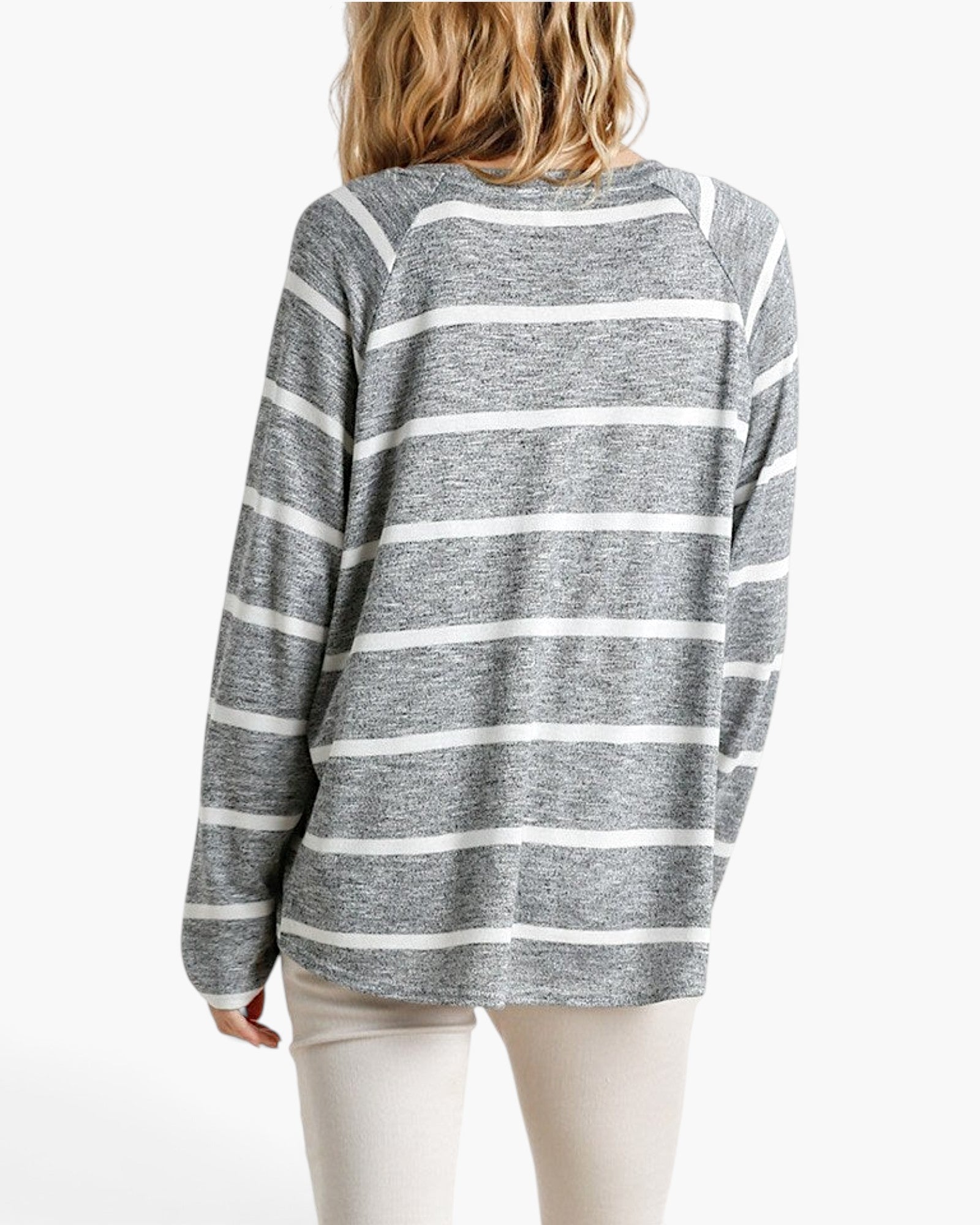 Beach Rose Co. long sleeve top with black and white horizontal stripes and a round neck, back view on a model.