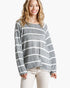 Beach Rose Co. model wearing a grey and white horizontal striped long sleeve top with a round neck