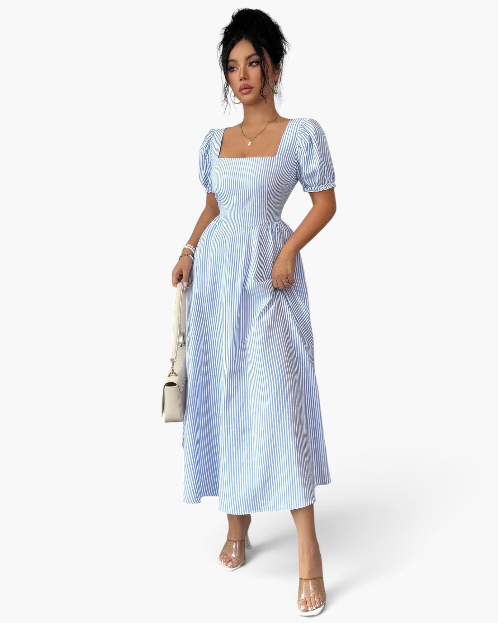 Beach Rose Co. blue and white striped midi dress with square neck, puff sleeves, and flowy silhouette on a model.
