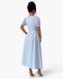 Beach Rose Co. blue and white striped midi dress with puff sleeves and backless design on a model
