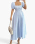 Beach Rose Co. blue and white striped midi dress with square neck, puff sleeves, and a flowy silhouette.