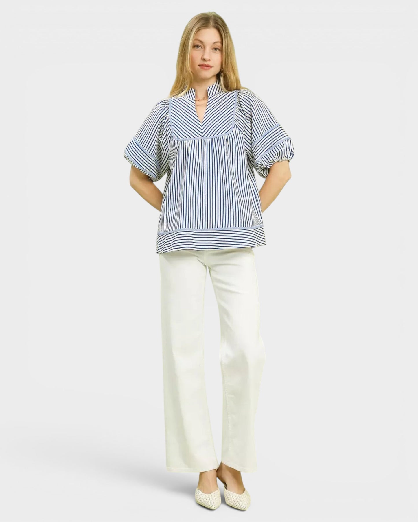 Beach Rose Co. blue and ivory striped puff sleeve babydoll top made of cotton and polyester blend.