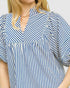 Beach Rose Co. ivory and blue striped puff sleeve top with a v-neck and babydoll silhouette made of cotton and polyester blend.
