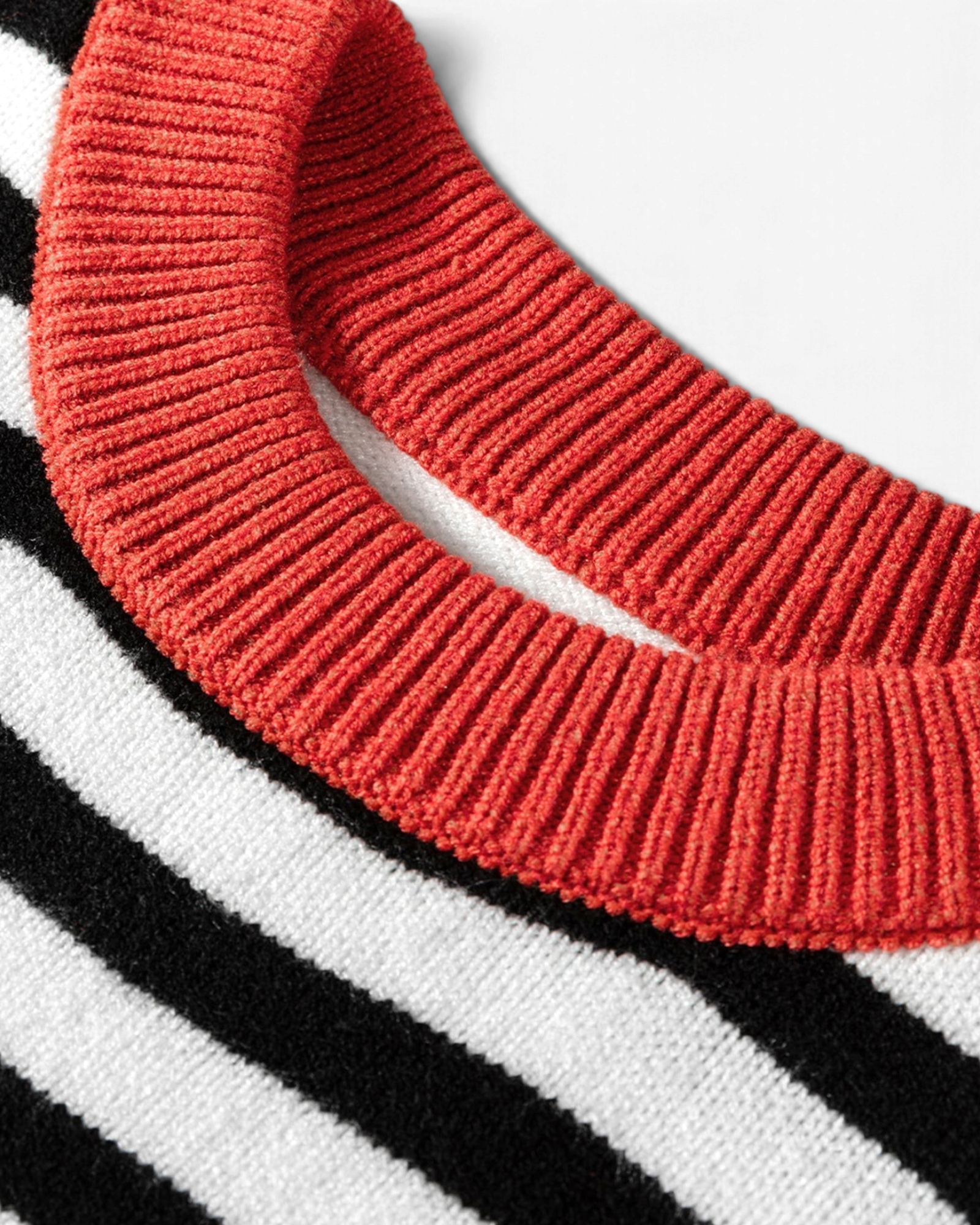 Beach Rose Co. black and cream striped sweater featuring a vibrant rust ribbed crew neckline in a soft knit blend.