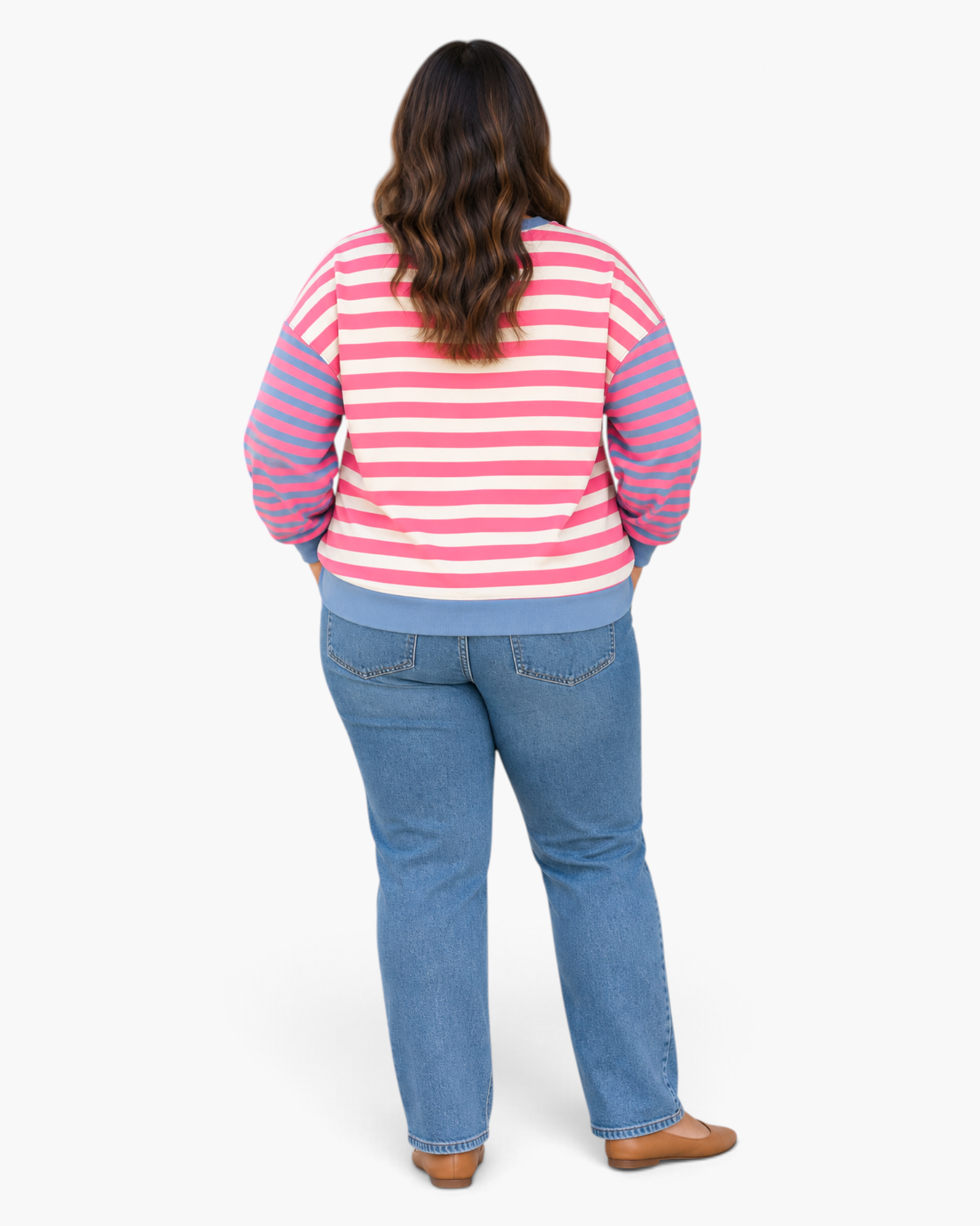 Beach Rose Co. pink and cream striped sweatshirt with blue sleeves and relaxed fit worn with blue jeans, back view.