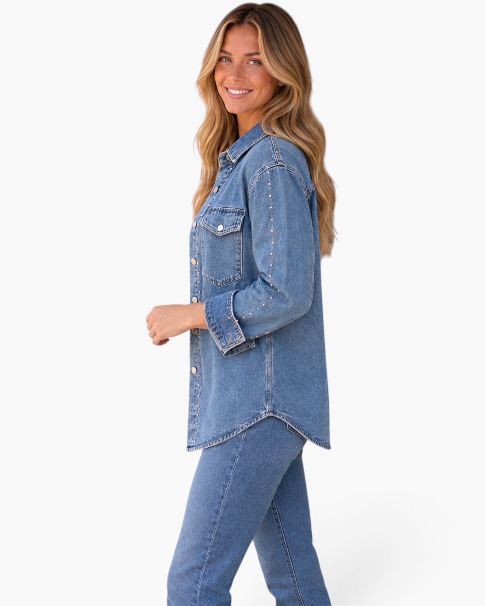 Beach Rose Co. blue denim shirt with metallic studs on sleeves and front, worn by a smiling model in profile view.