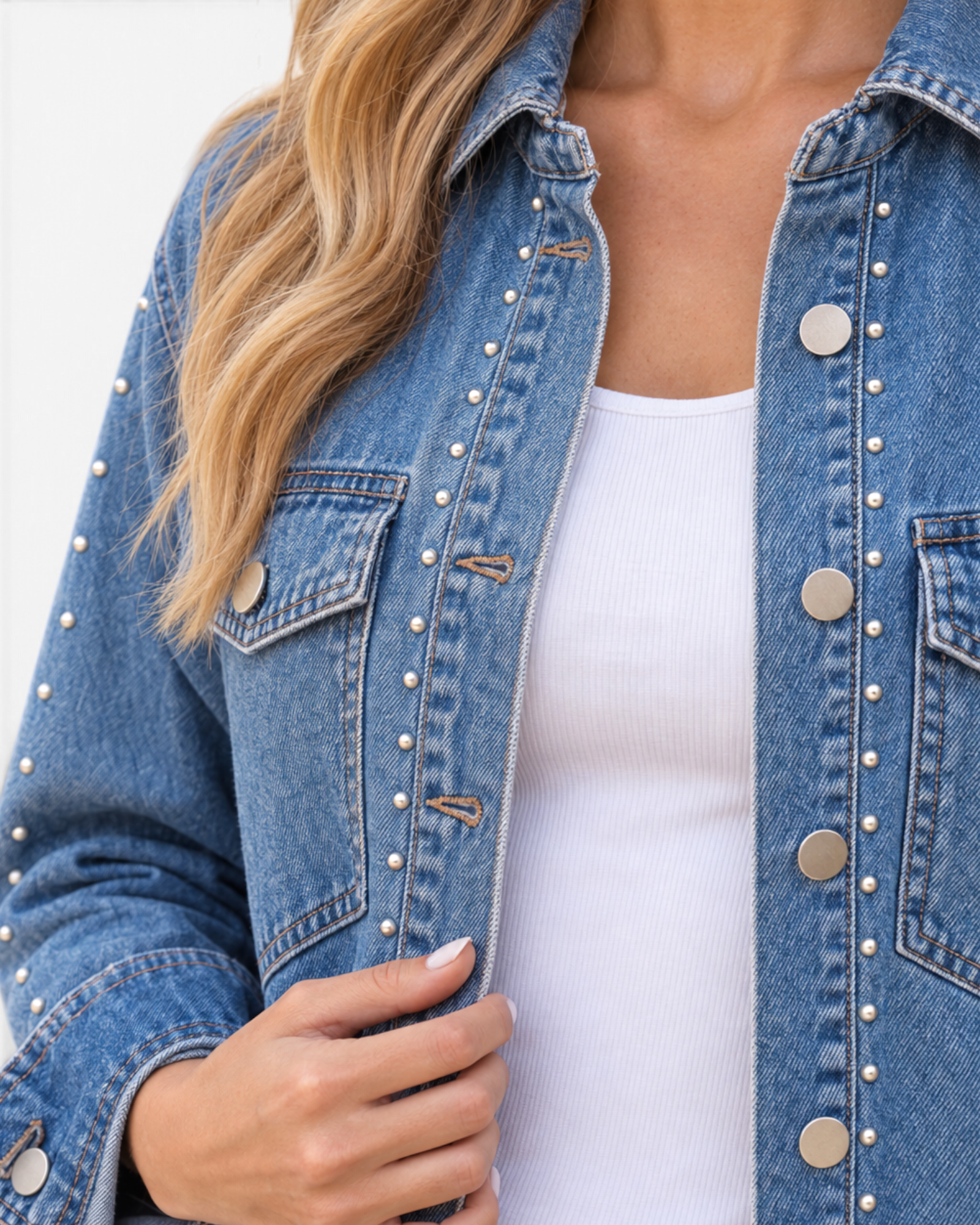 Beach Rose Co. blue denim shirt featuring metallic stud accents, a pointed collar, and metal button-front closure.